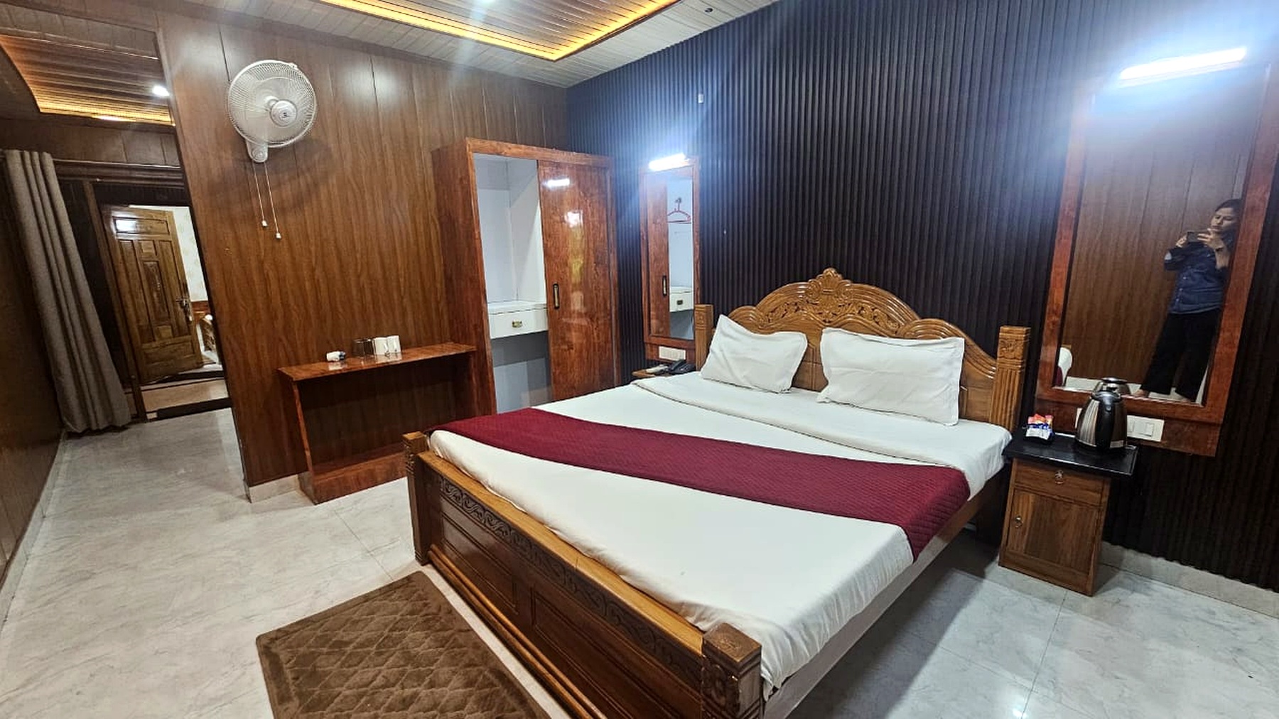 Wood panelled deluxe room at The Gautam Hotel
